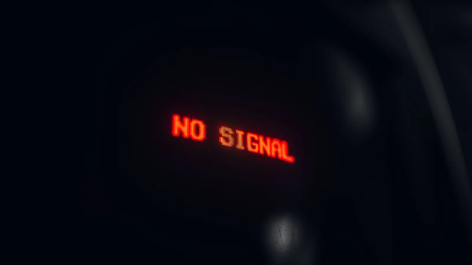 An electronic display screen showing the words no signal