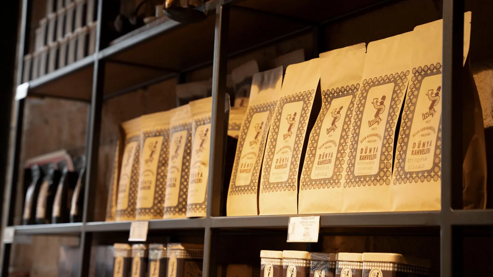 Packaged coffee bags lined up on a shop shelf