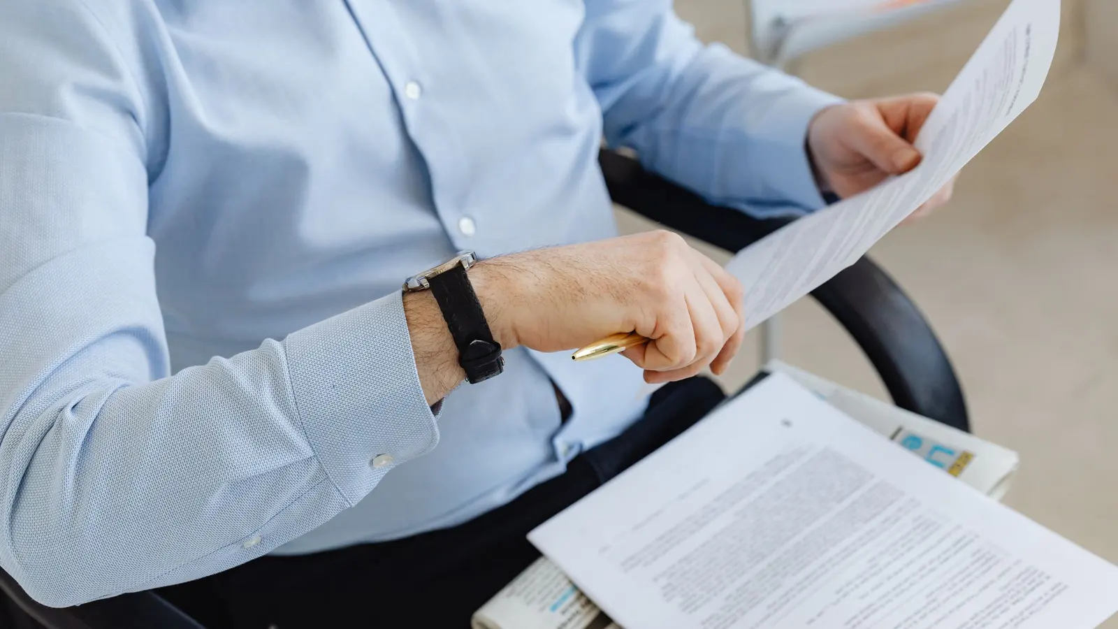 A marketer reviewing campaign data on two screens in an office