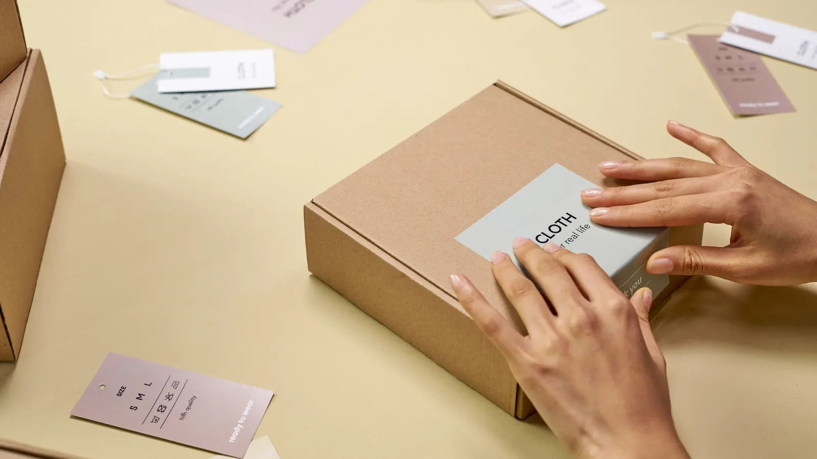 A small business owner packing an online order