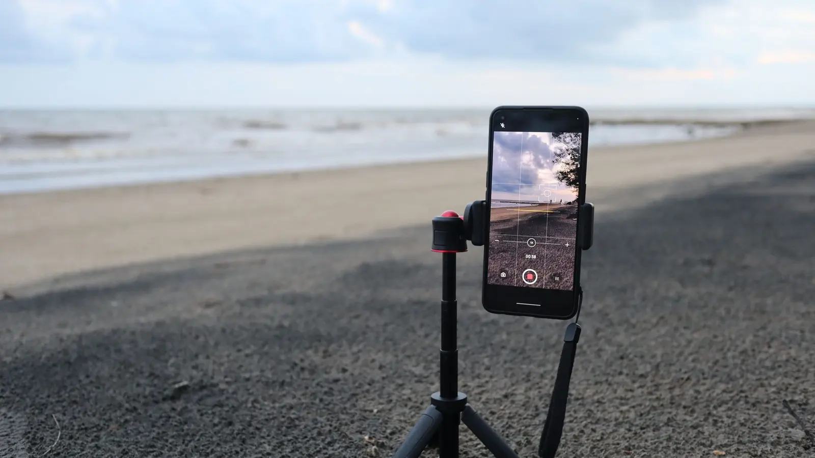 A phone on a tripod set up to record a short video