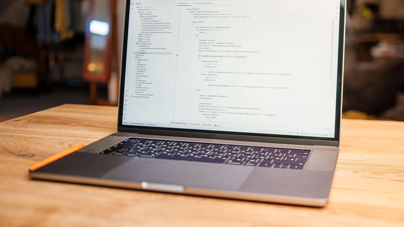 A laptop displaying a website editor on a desk