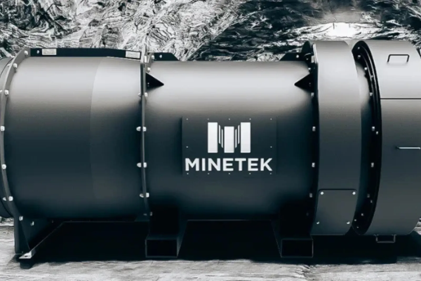 Minetek-branded industrial fan unit photographed against a rock face