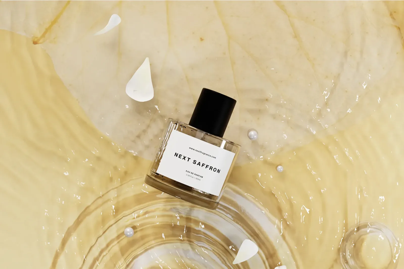 Next Saffron eau de parfum bottle resting on rippling golden water scattered with petals